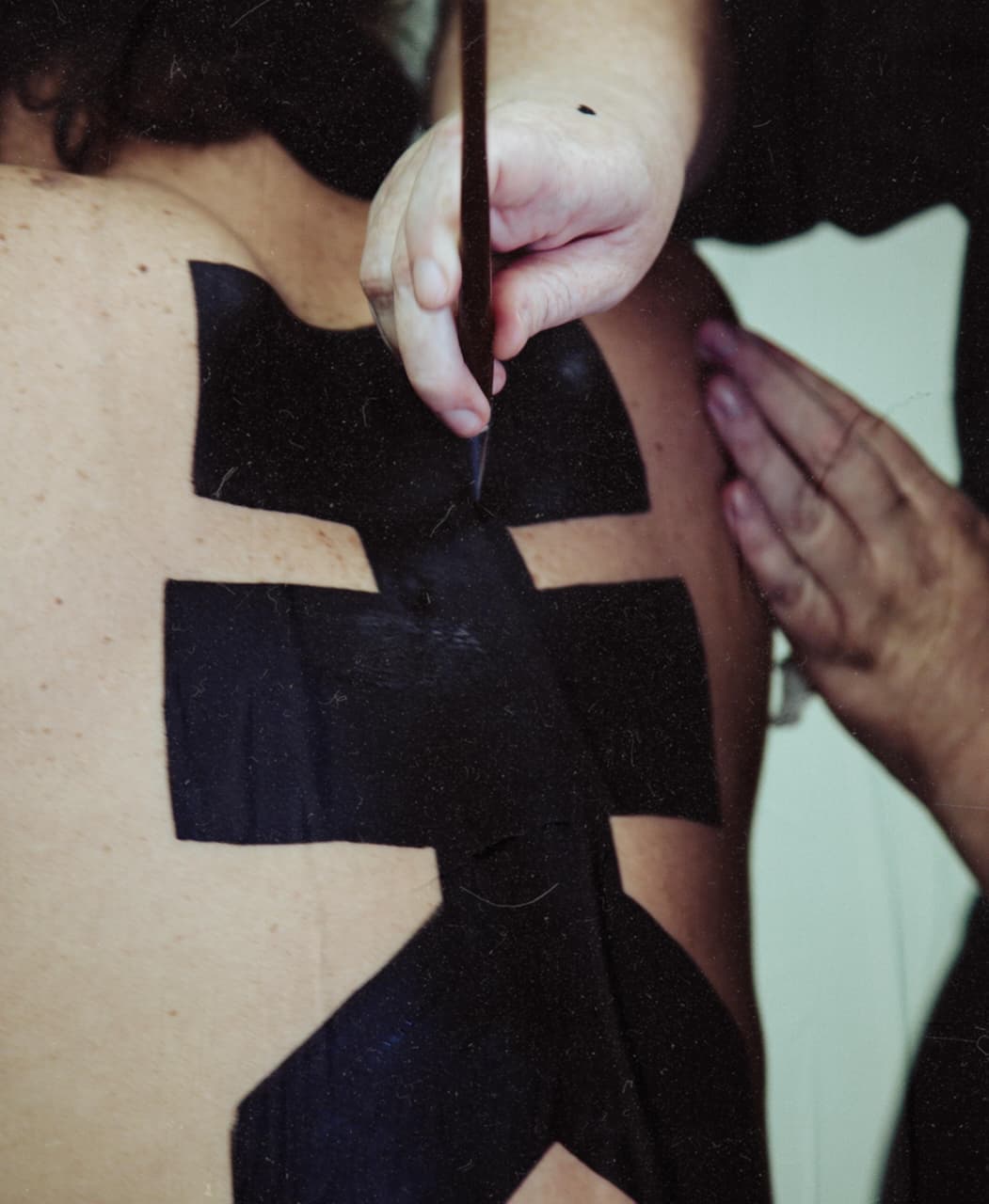 Detailed logo body painting created for the Hunter Kennedy fashion shoot